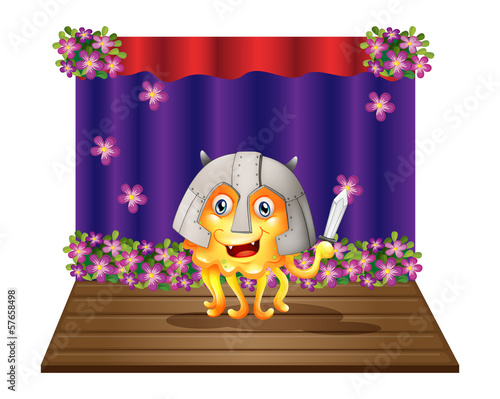 A monster wearing a helmet standing in the middle of the stage