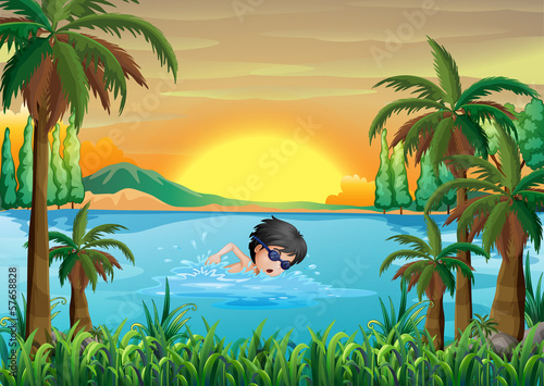 A boy swimming at the lake
