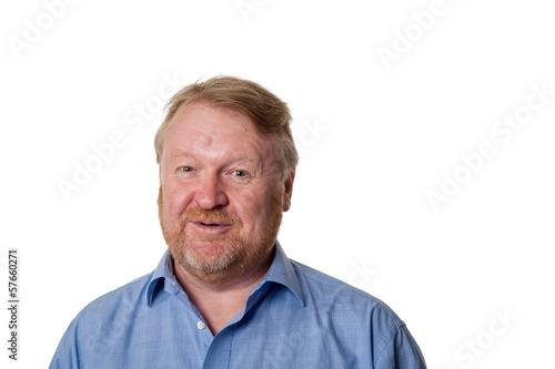 Laughing middle aged bearded guy in blue shirt - on white