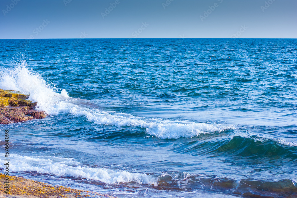 rock and waves in sea