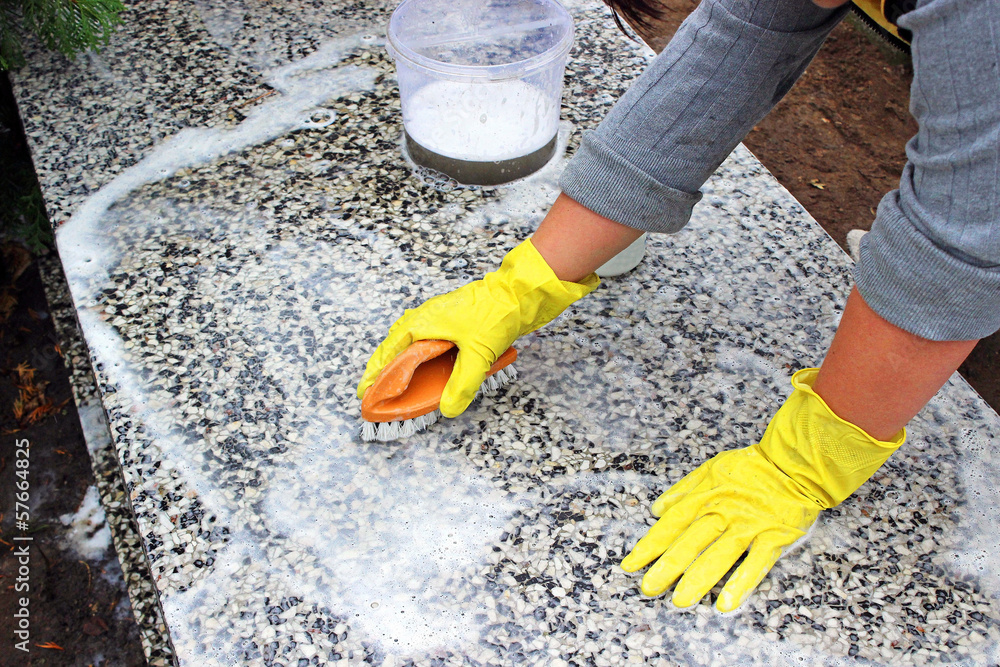 cleaning of the monument at the cemetery before All Saints Day