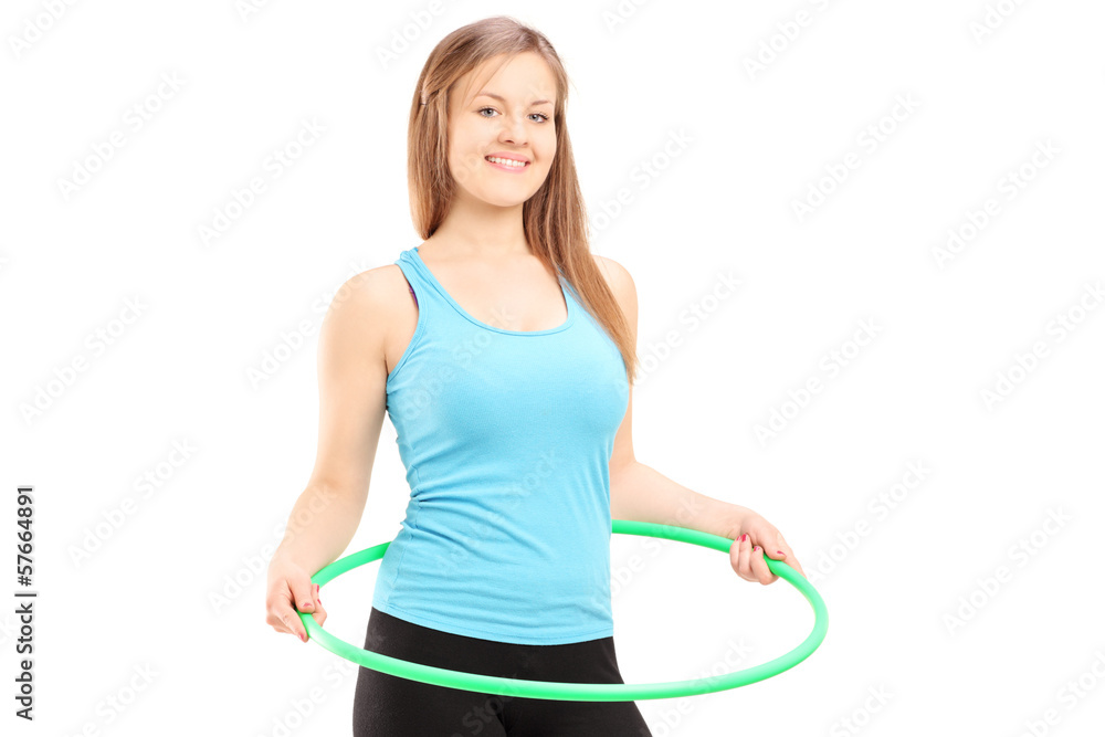 Young female athlete exercising with a hula-hoop Young female athlete exercising with a hula-hoop
