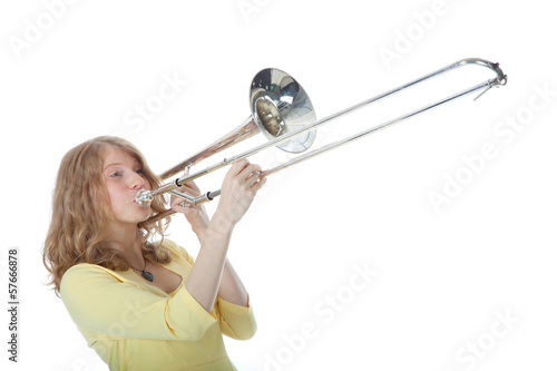 young woman in yellow with trombone photo