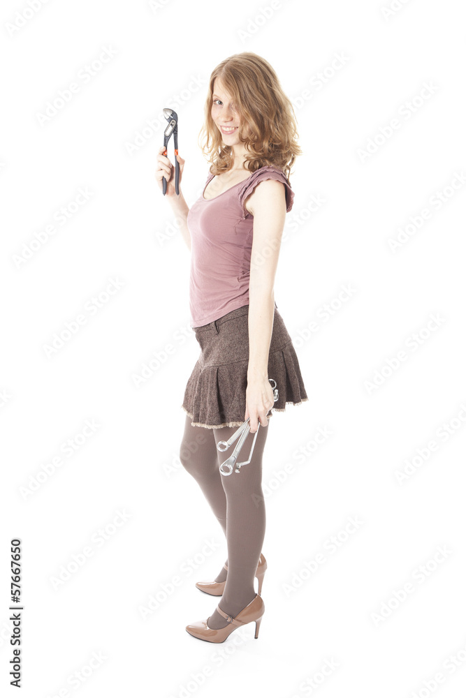 young pretty woman with ring spanners and pipe wrench young pretty woman with ring spanners and pipe wrench
