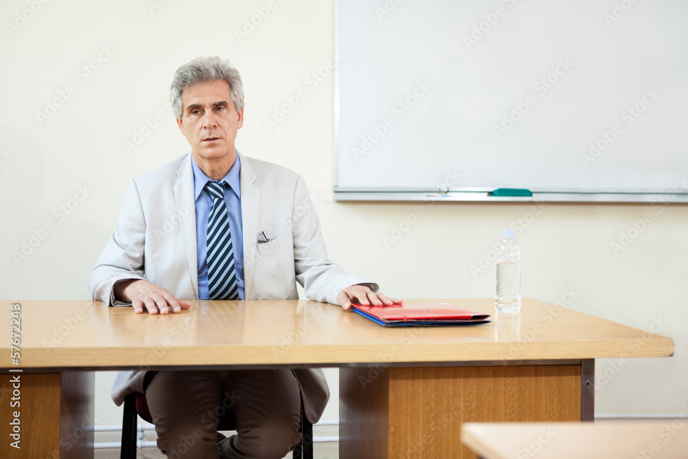 professor sitting at desk professor sitting at desk
