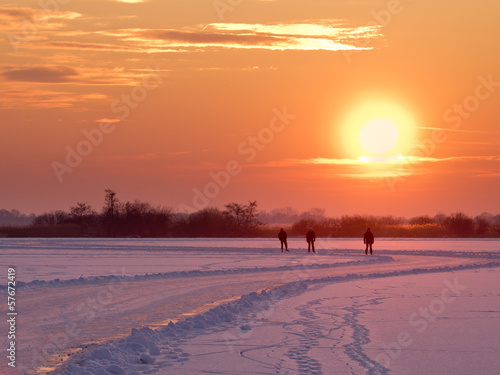 Speed skaters are aproaching photo