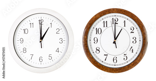 Two clock faces showing one o'clock