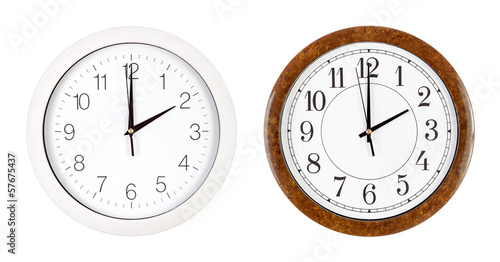 Two clock faces showing two o'clock