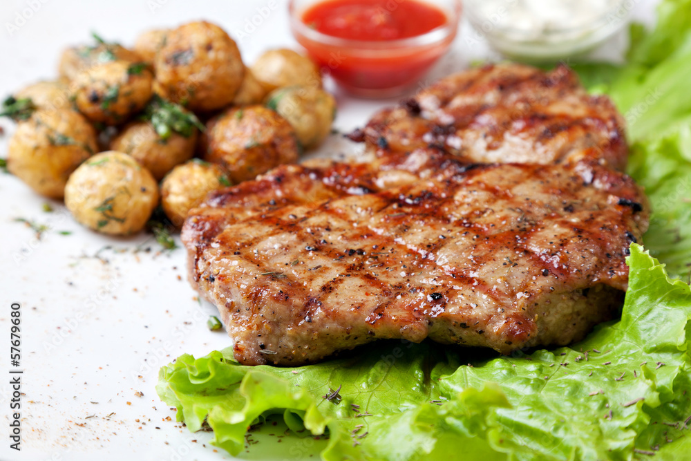 Grilled steak on a white plate Grilled steak on a white plate