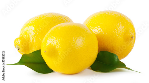 Fotografija Three ripe lemons with leaves