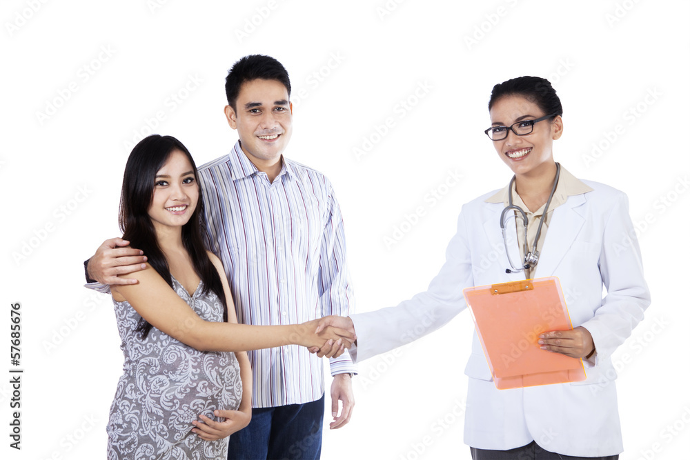Pregnant woman handshake with an obstetrician Pregnant woman handshake with an obstetrician