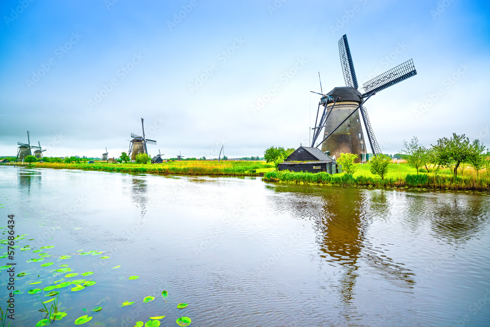 Windmills and canal in Kinderdijk, Holland or Netherlands.