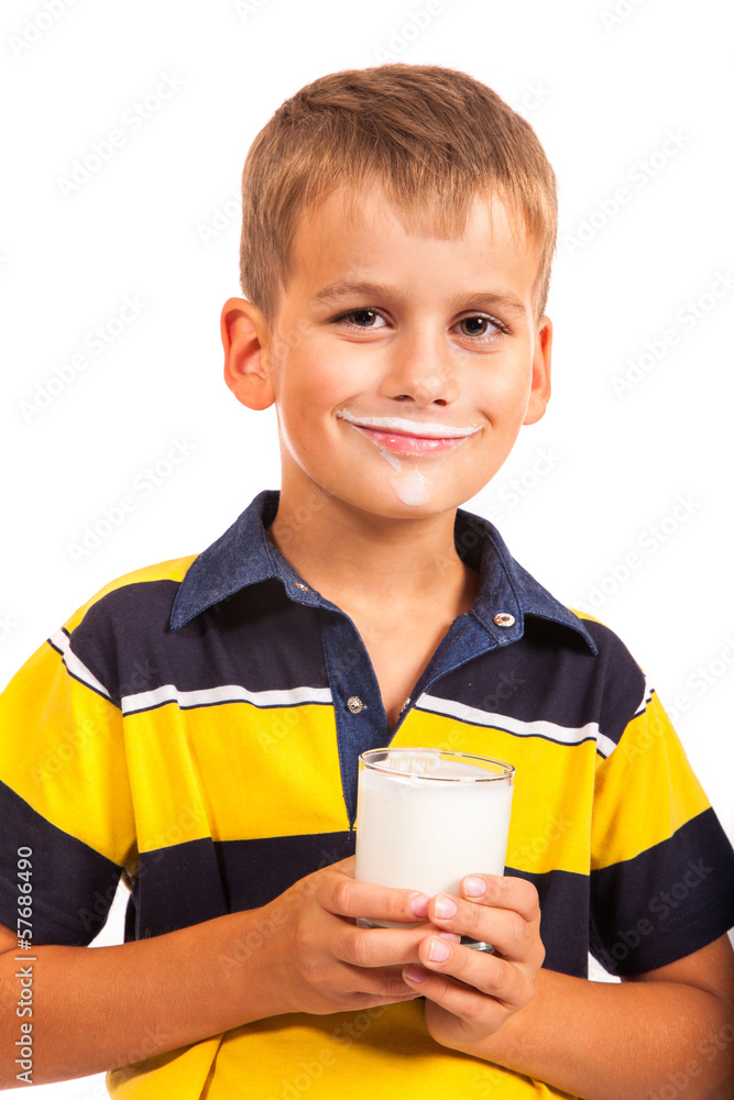 Young boy has moustache of milk on his lips Young boy has moustache of milk on his lips
