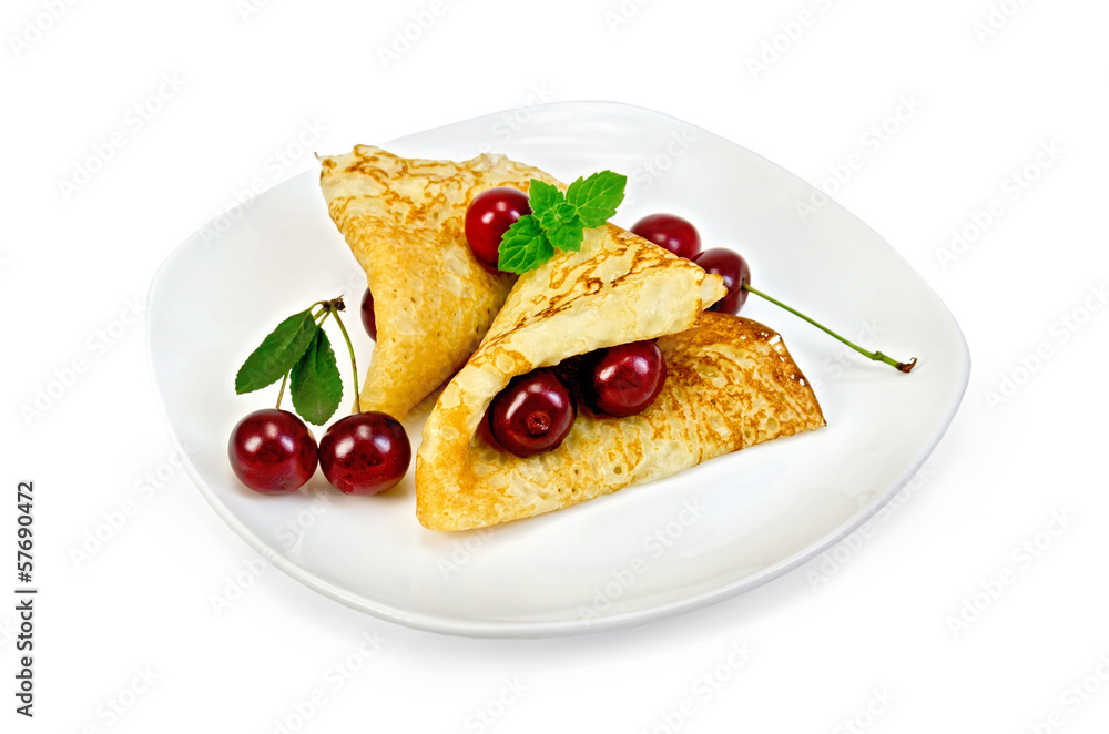 Pancakes with cherries on a plate
