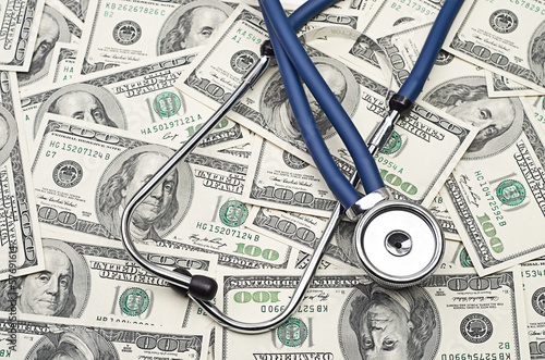 heap of dollars with stethoscope