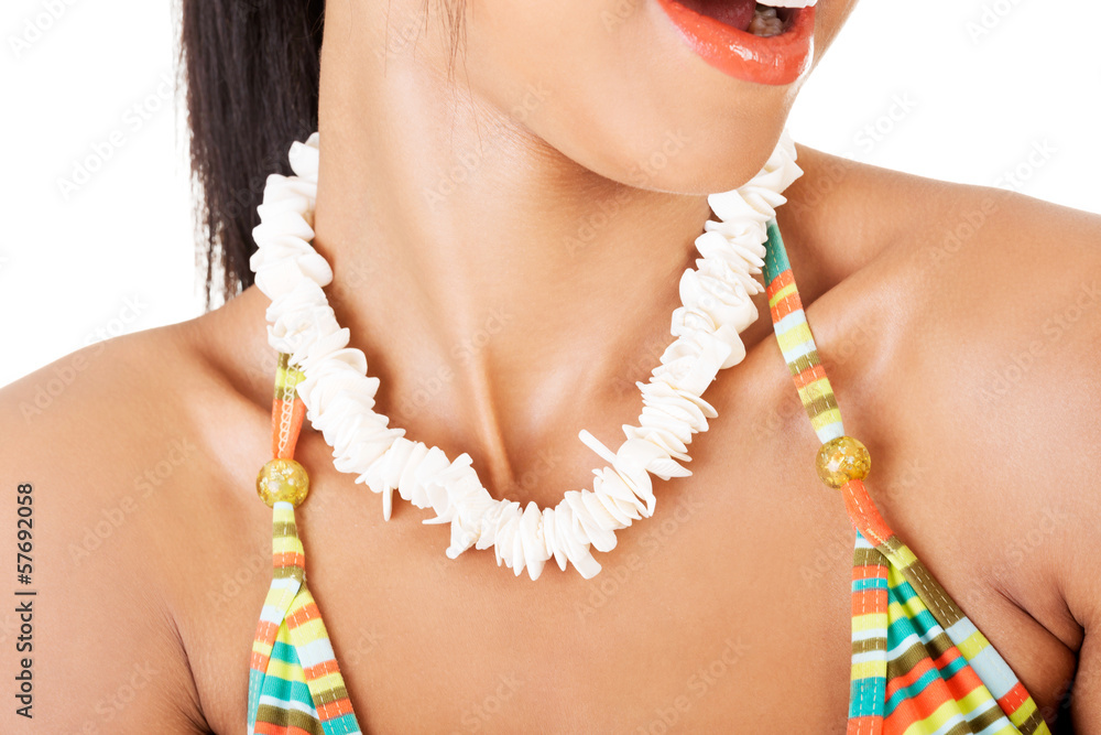 Young woman's necklace closeup in swimsuit.