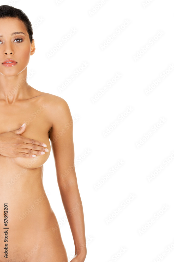 Young woman doing self brast examination, holdin her breasts. Young woman doing self brast examination, holdin her breasts.