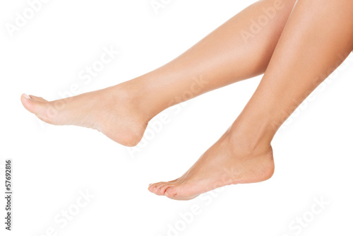 Female smooth feet and legs. Closeup. © Piotr Marcinski