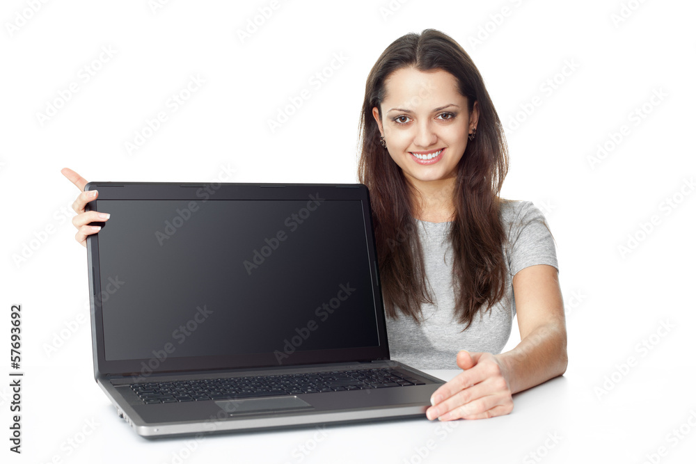 Young woman showing a laptop Young woman showing a laptop