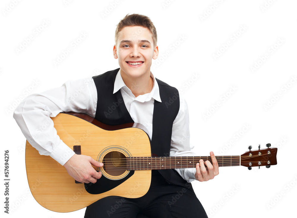 Young man playing on guitar