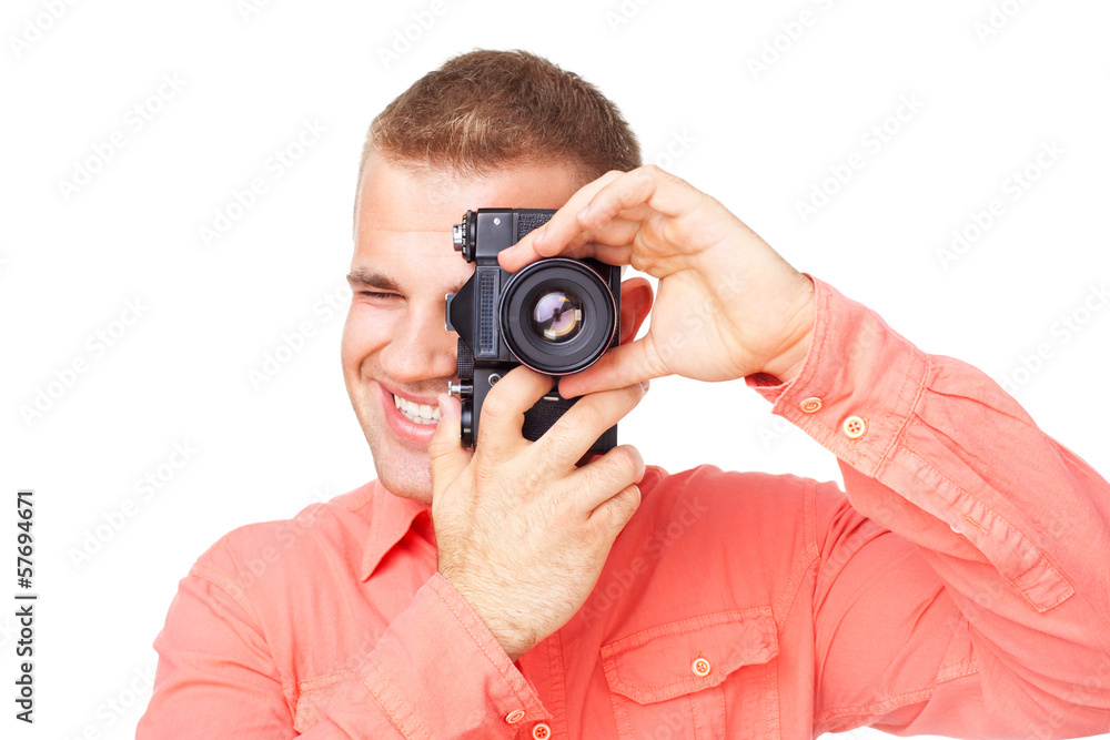 Young photographer taking pictures with his camera Young photographer taking pictures with his camera