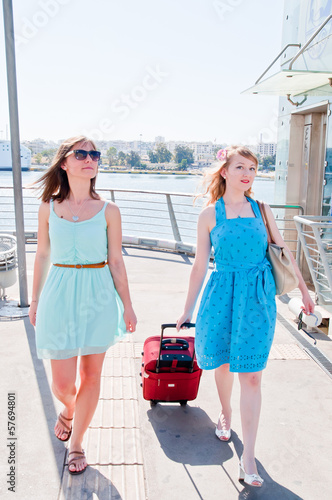 young and beautiful woman with suitcases
