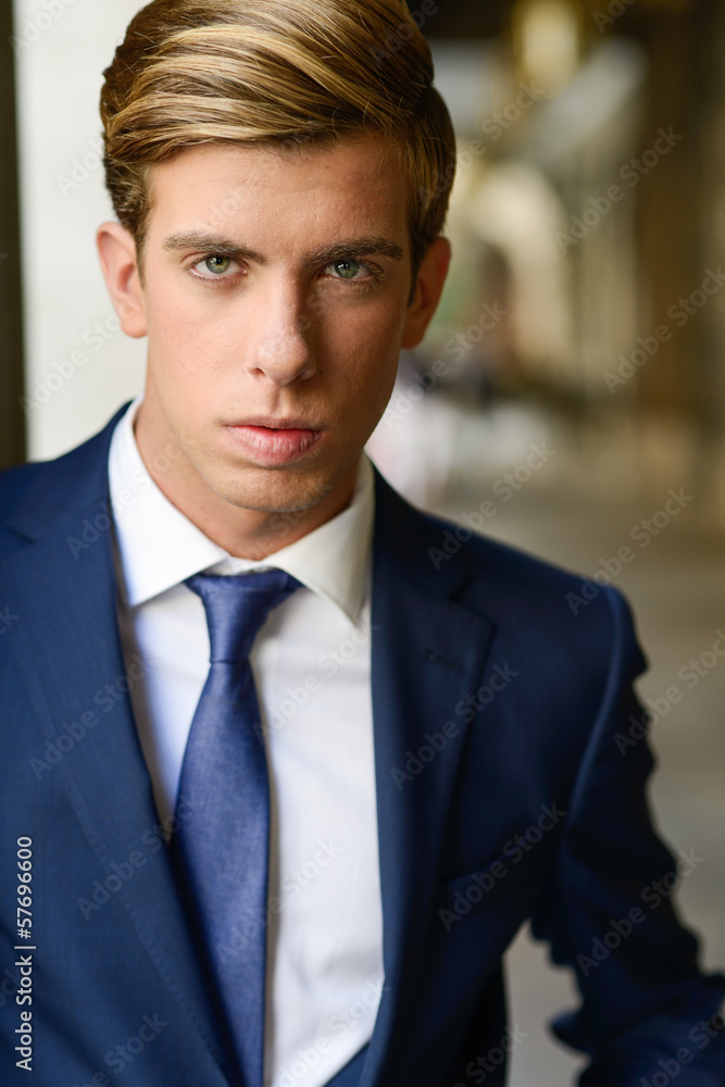 Attractive young businessman in urban background Attractive young businessman in urban background