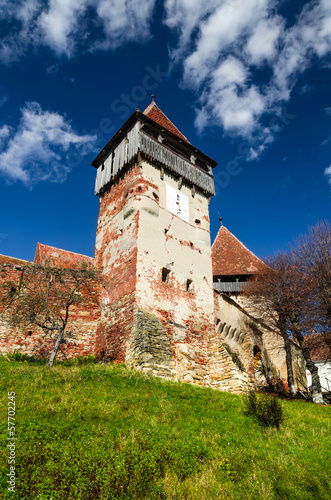 Tower and walls of fortified church Alma Vii, Transylvania. Roma