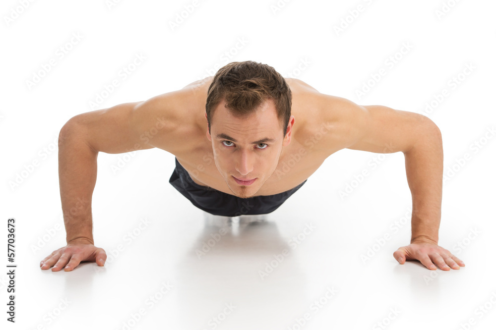 fitness man exercising push ups smiling happy. fitness man exercising push ups smiling happy.