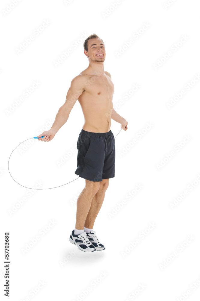 Fototapeta premium Fit man jumping with skipping rope.