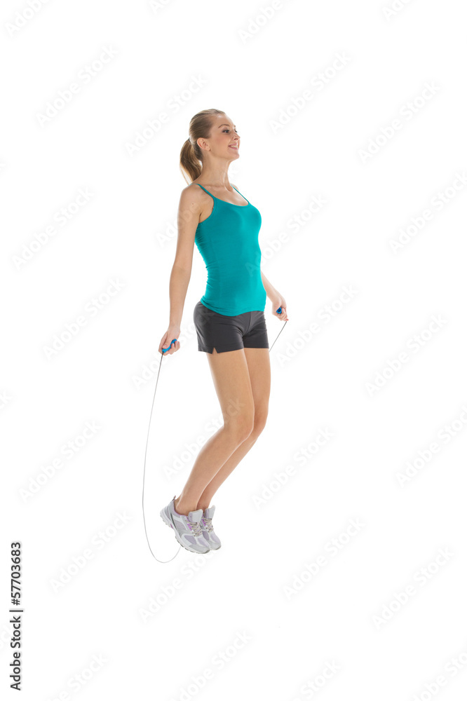 Young woman is training with skipping rope. Young woman is training with skipping rope.