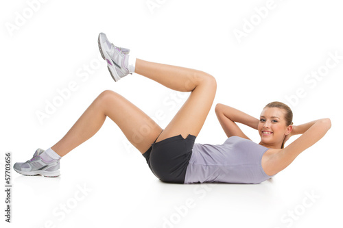 Athletic woman doing exercise to keep her body in shape.
