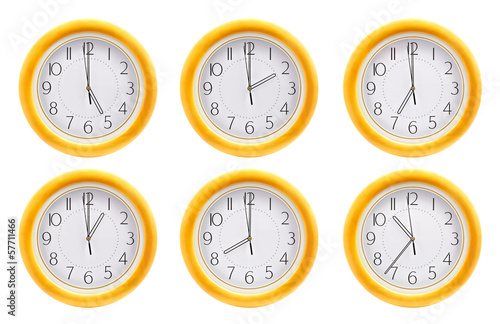 Group of wall clocks isolated on white background