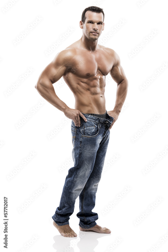 Muscle man posing in studio, isolated over a white background Muscle man posing in studio, isolated over a white background