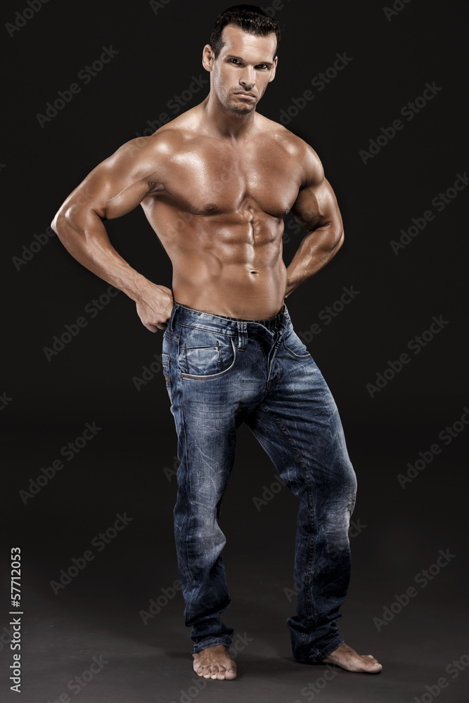 Muscle man posing in studio, isolated over a white background Muscle man posing in studio, isolated over a white background