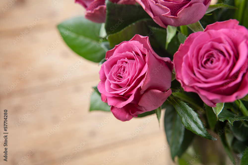 Bouquet of beautiful pink roses on wooden background. Bouquet of beautiful pink roses on wooden background.