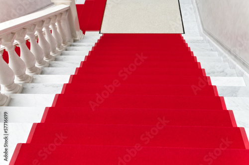 red carpet on white marble staircase