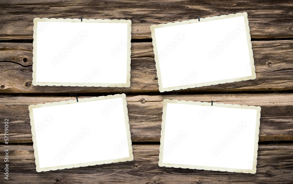 old empty photoframes on wooden board old empty photoframes on wooden board