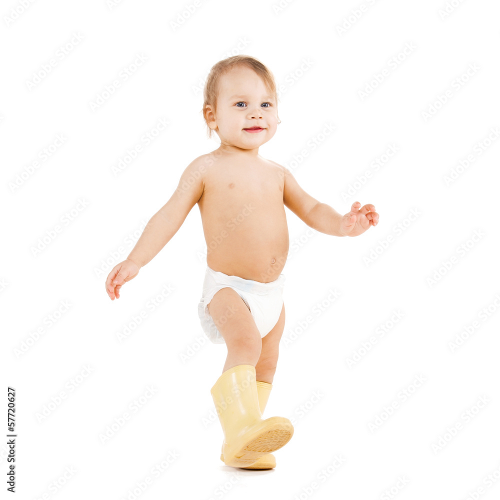 cute little boy walking in big rubber boots cute little boy walking in big rubber boots