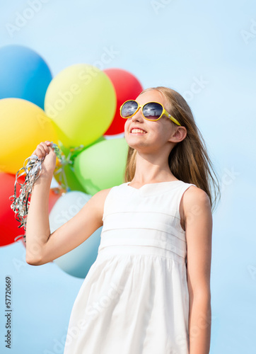 happy girl with colorful balloons