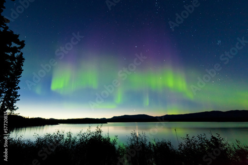 Summer night Northern lights over Lake Laberge photo