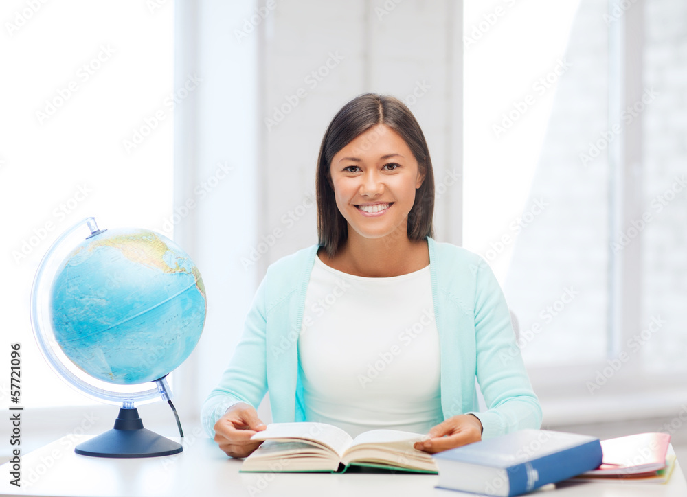 teacher with globe and book at school teacher with globe and book at school