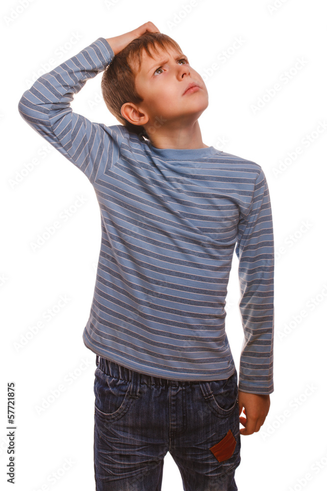 blond kid boy in striped sweater thinks scratching his head hair blond kid boy in striped sweater thinks scratching his head hair