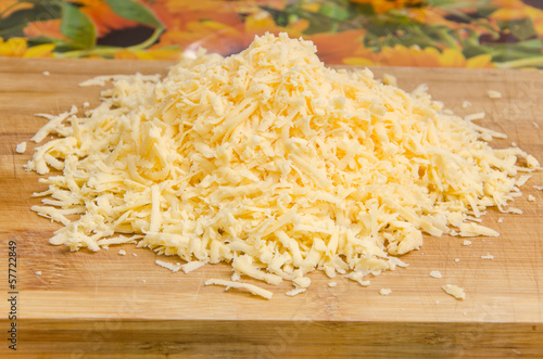 Grated cheese on a cutting board