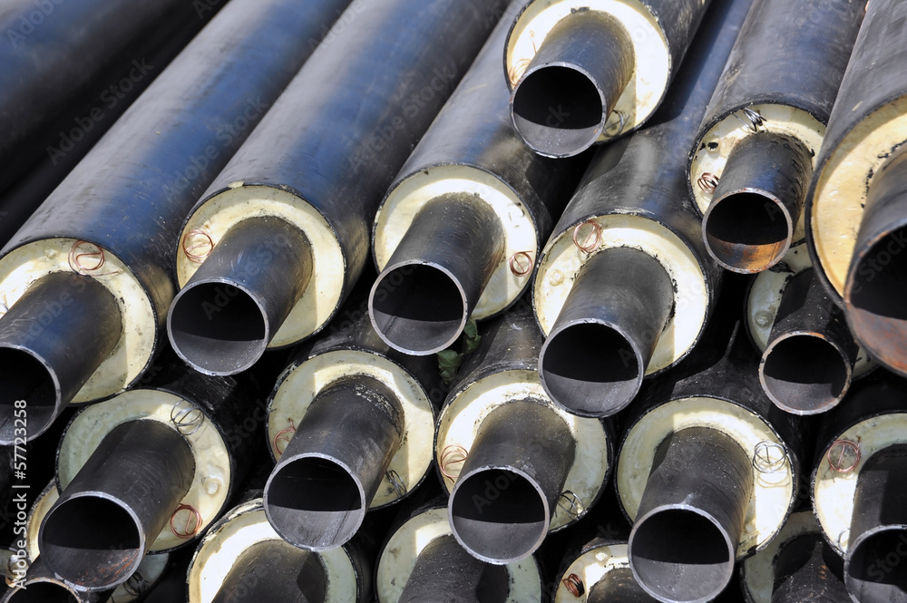 Rusty steel pipe with heat insulation on construction site Rusty steel pipe with heat insulation on construction site