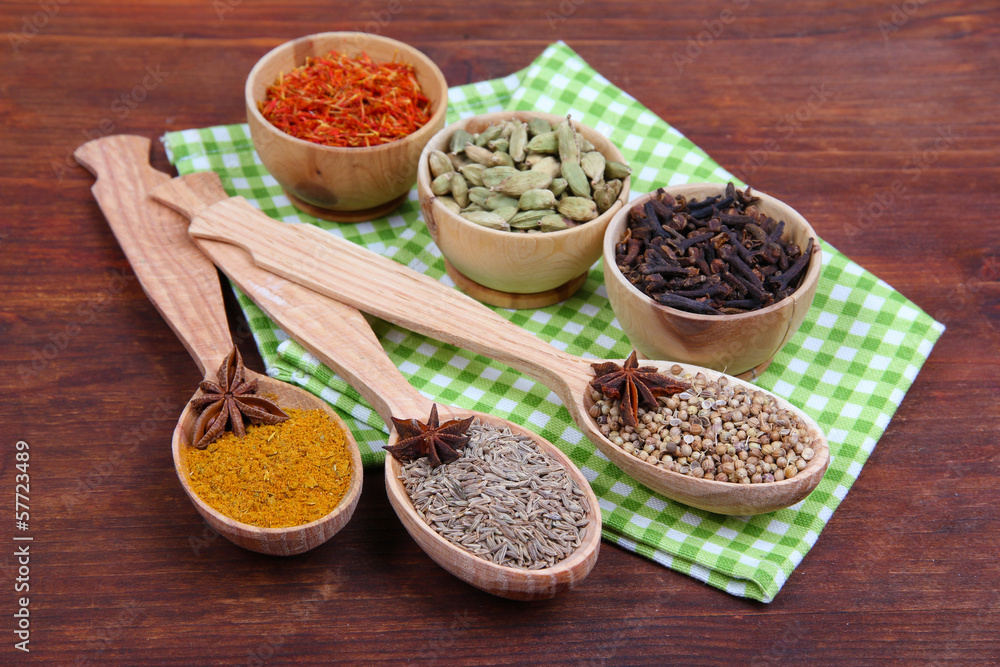 Various spices and herbs on wooden background Various spices and herbs on wooden background