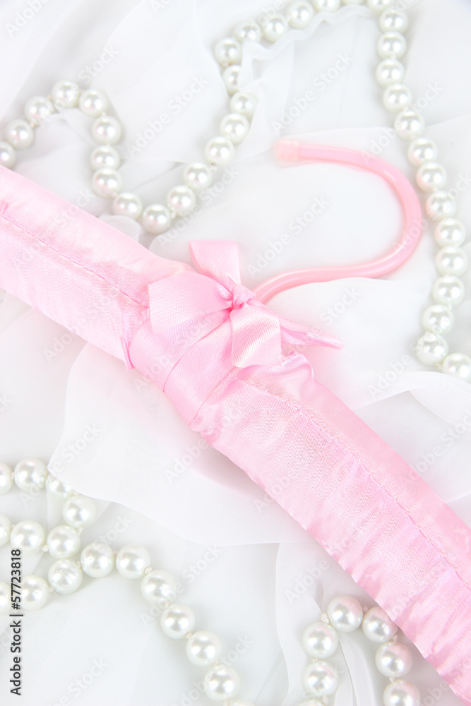 Beautiful hanger on fabric background Beautiful hanger on fabric background