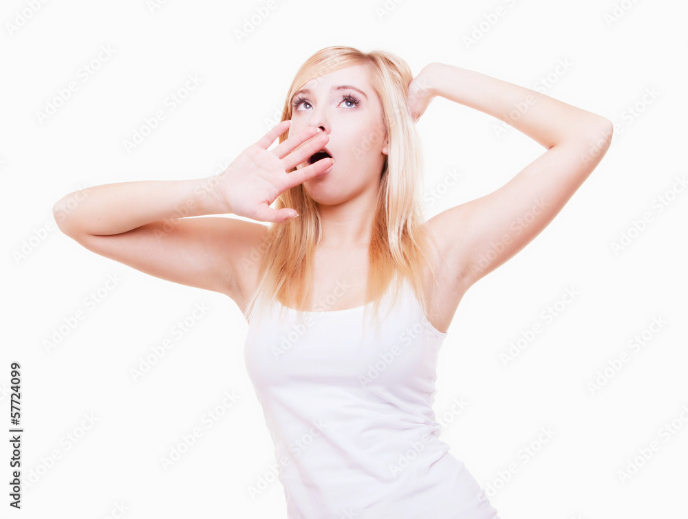 Sleepy tired young woman yawning isolated on white Sleepy tired young woman yawning isolated on white