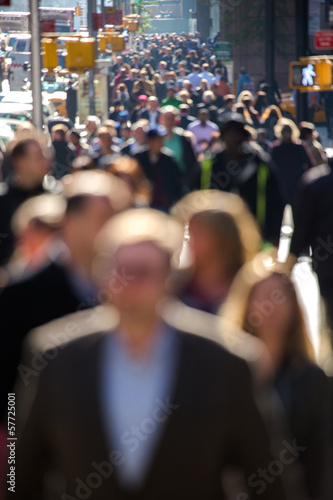 Anonymous crowd walking on a street in New York