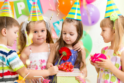 pretty children with gifts on birthday party